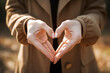 © Impressionstock - Close-up of two hands making heart shape