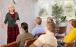 © JackF - Mature female teacher conducts training for the elderly at the university