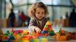 Joyful young child engaged in building blocks play in a mall or busy room, emphasizing creativity and fun