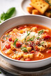 Leinwandbild Motiv Pasta Fagioli soup in a white bowl with fresh herbs
