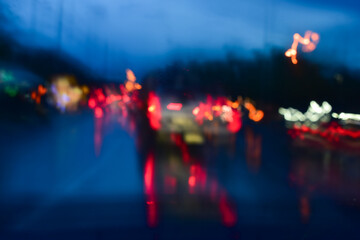 Wall Mural - light of car on road with accident in the night, blurred background in rainy day