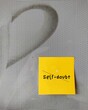 Stick yellow note on gray background with text  Self-doubt - means lacking of confidence or have a mindset that holds you back from succeeding leads to imposter syndrome or self-sabotage