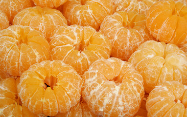 Wall Mural - Many peeled fresh ripe tangerines as background