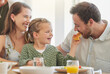 © K Davis/peopleimages.com - Breakfast, family and eating with parents, mother and happy kid together in a home. Love, support and care on a dining room with a smile and food with bonding in the morning with waffle in a house