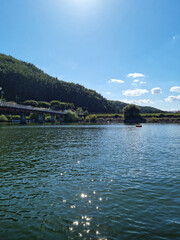 Canvas Print - A lake with water sparkling in the sunlight.