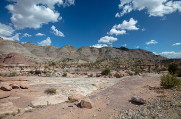 Rocky mountain sandstone wash under cloudy sky in Little Book Cliffs National Monument near De Beque Colorado United States