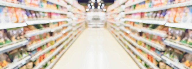 Wall Mural - supermarket aisle and shelves blurred background