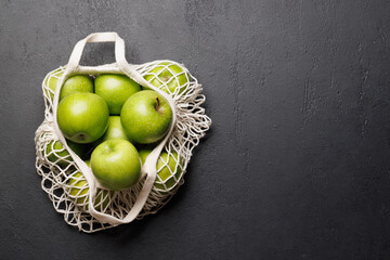 Wall Mural - Mesh bag with fresh green apples