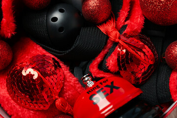 Canvas Print - Sex toys with Christmas decorations on a dark background.