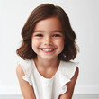 Portrait of a little princess turning five, exuding happiness with a heartwarming smile, against a pure white background.