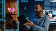 African american technology internet star filming review of newly released graphic tablet, greeting audience and presenting them feedback about touchscreen sensitivity, doing endorsement