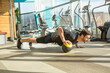 Man doing electro muscular stimulation training in a modern gym