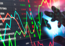Trader Checking Stock Market Data On Screen