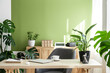 © Westend61 - Modern bright interior of home office with furniture and plants at desk