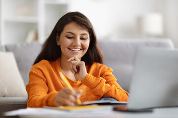 Wall Mural - Closeup indian woman student have online lesson, home interior, e-education