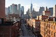 © Westend61 - Buildings with modern skyscraper in lower east side Manhattan