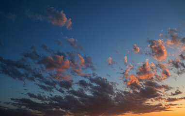 Sunset sky with orange clouds. Nature background.