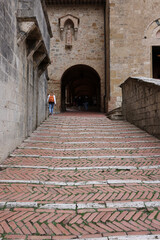 Wall Mural - Entrance to the Courtyard of Palazzo Comunale, also known as the Palazzo del Popolo in San Gimignano. Tuscany, Italy