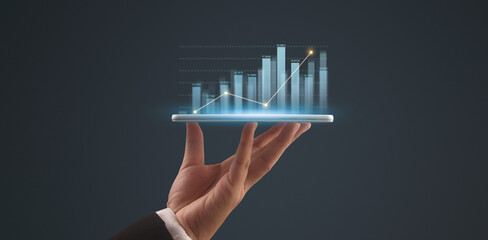 Wall Mural - Businessman plan graph growth and increase of chart positive indicators,tablet in hand