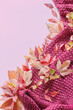 © Maya Kruchancova - pink autumn background with leaves and knitting