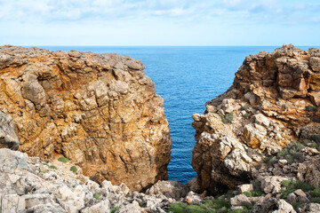 Wall Mural - Rocky coast of Punta Nati in Menorca island, Spain