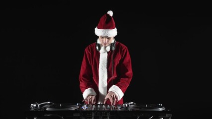 Wall Mural - Santa Claus Dj playing music on a Christmas party in night club