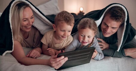 Wall Mural - Smile, tablet and family on a bed with a blanket relaxing, bonding and watching a movie or show. Happy, digital technology and children laying and networking with parents in bedroom together in house