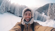 © Hamza - Young man taking a selfie in a snowy mountain landscape, wearing winter clothes a beige coat with a fur hood