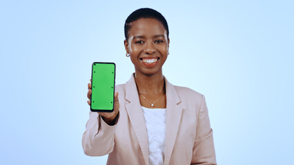 Wall Mural - Happy black woman, portrait or phone green screen mockup for social media advertising. Blue background, review or business person with chroma key on mobile app display for marketing space in studio