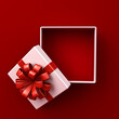 Leinwandbild Motiv Blank white gift box open or top view of white present box tied with red ribbon bow isolated on dark red background with shadow minimal conceptual 3D rendering