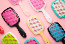 Set Of Hairbrushes On Pink Background. Flat Lay