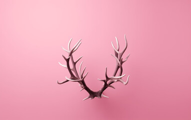 Wall Mural - Reindeer antlers on a pink background. Style of minimalist still life. Xmas composition. Copy space. Minimal winter holiday concept.