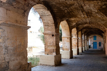 Wall Mural - St. Nicholas former monastery at Crete island, Chania Old Town, Greece. Arched stonewall building.