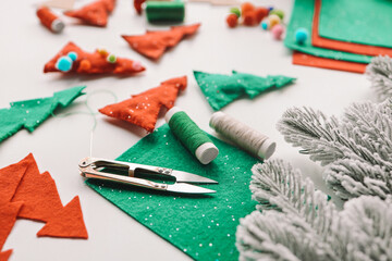 Composition with threads and sewing accessories on white background