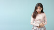 © pariketan - Asian little girl wincing in pain and hand rubbing stomach