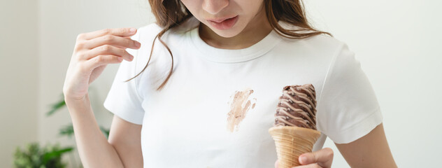 Wall Mural - dirty food mark on clothes, Close-up food stain dirt on the shirt prepare cleaning mark removal before laundry.