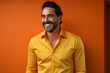© bravissimos - Happy young and smiling man with copy space. Well dressed against solid background.