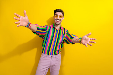 Poster - Photo of friendly young guy welcome you on theme party wearing hippie vintage clothes open arms isolated over yellow color background