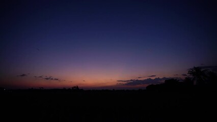 Wall Mural - twilight sky with clouds at sunset in winter season nature in thailand. timelapse video