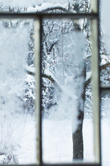 Wall Mural - old window with snowy beautiful landscape