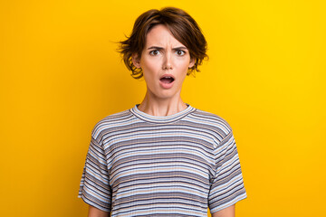 Poster - Portrait of offended abused nice girl with short hairstyle wear grey t-shirt staring with blame isolated on yellow color background