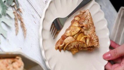 Wall Mural - Piece of apple tart tatine with cinnamon. Homemade pastry.