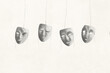 © fran_kie - illustration of series of theatrical masks hanging in the white, surreal identity concept