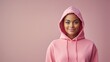 Thoughtful alluring african-american female with brief hair, wear pink in vogue hoodie, sulking and looking cleared out inquisitive, thinking