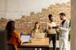 © BGStock72 - Young multiethnic startup team working by the brick wall in the industrial style office