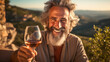 a male winemaker sits at a table with food and a glass of wine, testing wine while in the vineyards overlooking the hills and authentic locations of old towns