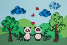 Cute Couple Panda In Love With Hearts. Two Funny Pandas Quilling Character In Field, Near Trees In Summer Day With Clouds. Happy Cute Panda Fall In Love. Hand Made Of Paper Quilling Technique.