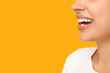 Pretty young woman taking vitamin A capsule on yellow background, closeup