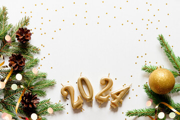 Wall Mural - christmas card banner with christmas tree branches and gold candle numbers 2024, golden decorative r