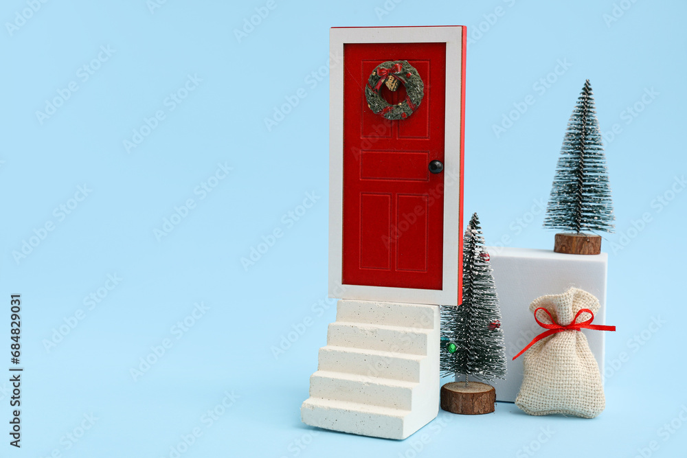 Decorative podiums with Christmas decorations on blue background